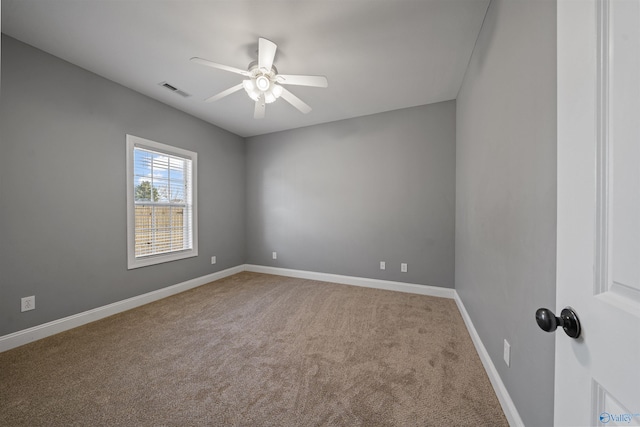 carpeted empty room with ceiling fan