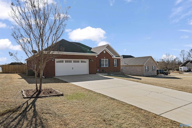 ranch-style house featuring a garage, a front yard, and central AC