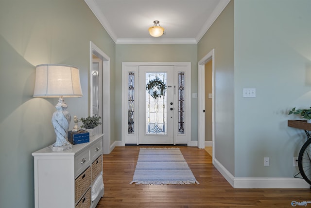 entryway with ornamental molding and hardwood / wood-style floors