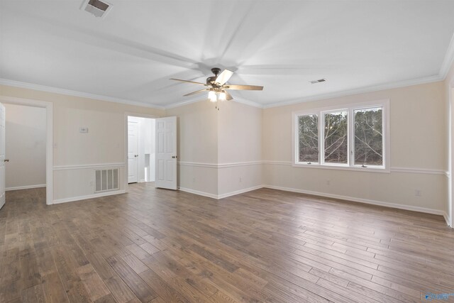 empty room featuring hardwood / wood-style floors, ceiling fan, and visible vents