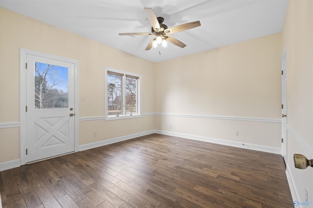 interior space featuring dark wood-style floors, baseboards, and ceiling fan
