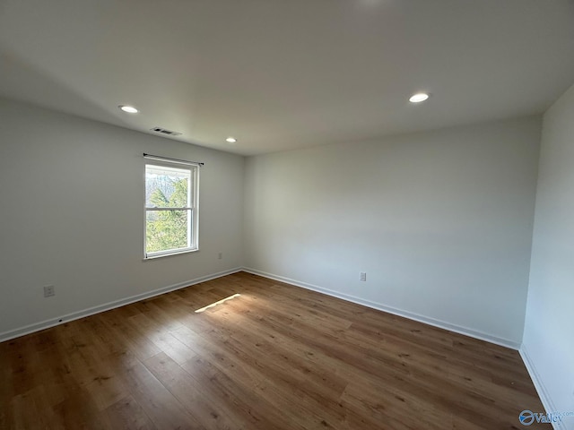 spare room featuring hardwood / wood-style flooring