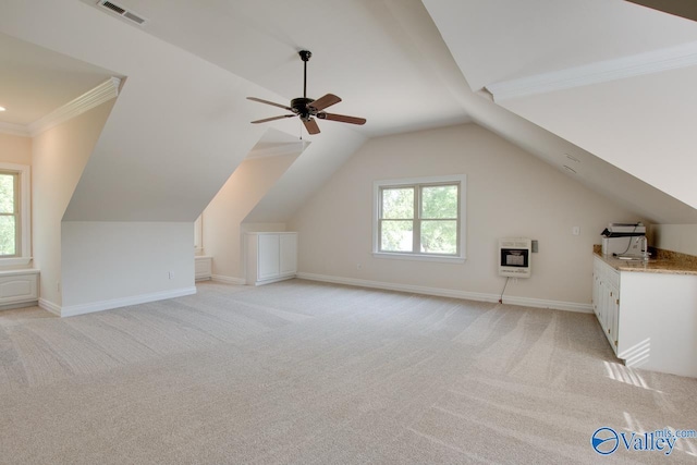 bonus room featuring visible vents, heating unit, lofted ceiling, and light carpet