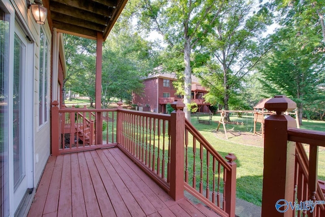 deck with a yard and a fenced backyard