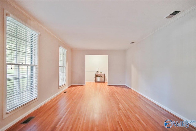 210 Spring Valley Ct SW, Huntsville, AL 35802 - unfurnished room featuring light wood-style floors and crown molding