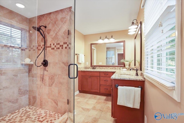 210 Spring Valley Ct SW, Huntsville, AL 35802 - bathroom with a shower stall, double vanity, and tile patterned floors