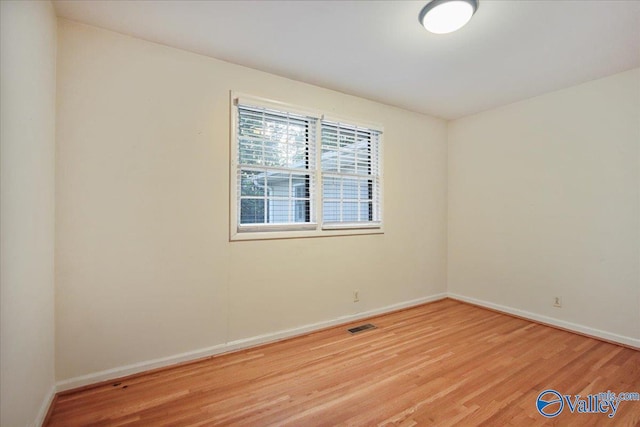 210 Spring Valley Ct SW, Huntsville, AL 35802 - spare room with light wood-style flooring and baseboards