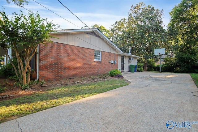 210 Spring Valley Ct SW, Huntsville, AL 35802 - view of side of property featuring driveway and brick siding