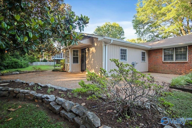 210 Spring Valley Ct SW, Huntsville, AL 35802 - view of property exterior with brick siding and a patio