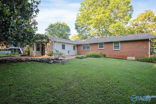 210 Spring Valley Ct SW, Huntsville, AL 35802 - back of house featuring a lawn and brick siding