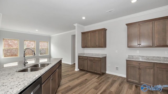 kitchen with light stone counters, dark hardwood / wood-style flooring, and sink