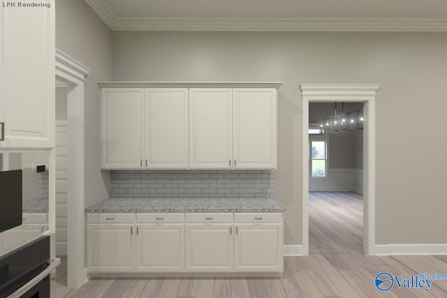 MCKINLEY-A1 Capshaw Rd, Athens, AL 35613 - kitchen featuring ornamental molding, light wood-style floors, white cabinets, light countertops, and decorative backsplash