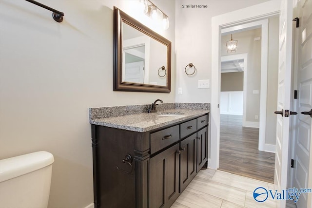 MCKINLEY-A1 Capshaw Rd, Athens, AL 35613 - bathroom featuring vanity, toilet, and baseboards