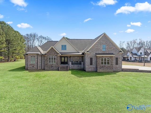 view of front of home with brick siding, crawl space, and a front yard