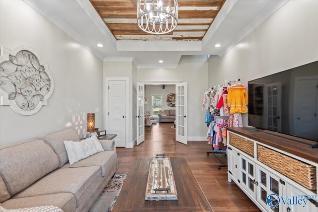 living room with baseboards, a raised ceiling, dark wood finished floors, french doors, and recessed lighting