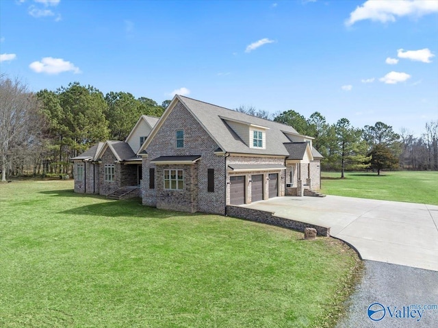 view of front of home with an attached garage, concrete driveway, brick siding, and a front yard