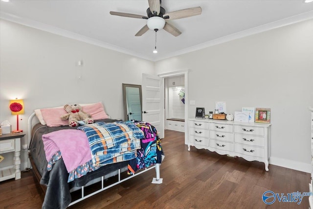 bedroom with ornamental molding, ceiling fan, dark wood-type flooring, and baseboards