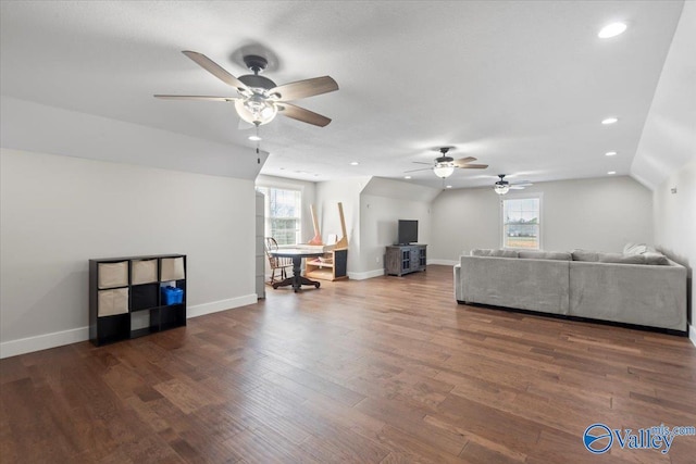 living area featuring baseboards, dark wood-style flooring, and recessed lighting