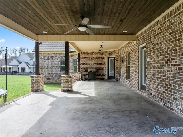 view of patio featuring a grill and ceiling fan