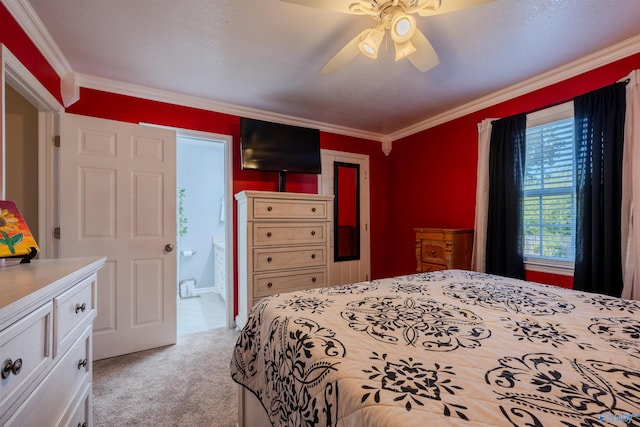 bedroom featuring connected bathroom, crown molding, light carpet, and ceiling fan