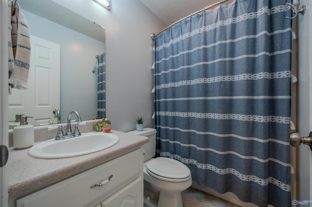 bathroom with vanity, toilet, and a shower with curtain