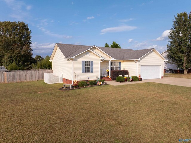 single story home featuring a front yard and a garage