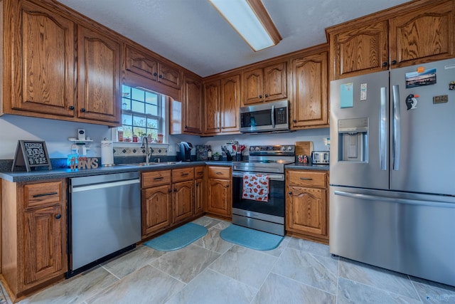 kitchen featuring appliances with stainless steel finishes and sink