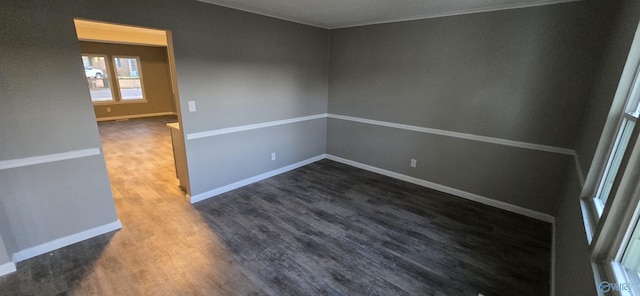 empty room with dark hardwood / wood-style floors