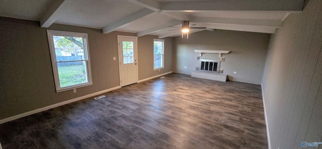 unfurnished living room featuring vaulted ceiling with beams, ceiling fan, and dark wood-type flooring