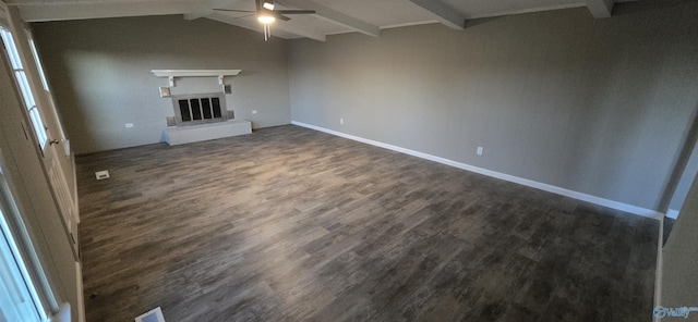 unfurnished living room featuring dark hardwood / wood-style floors, lofted ceiling with beams, and ceiling fan