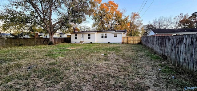 back of property with a yard
