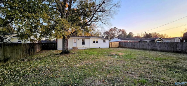 view of yard at dusk