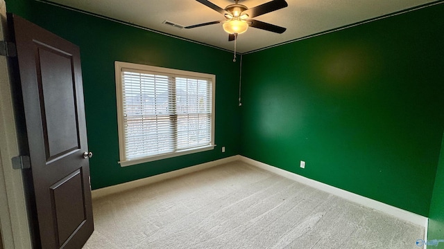 carpeted empty room with ceiling fan