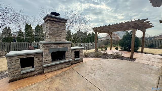 view of patio with an outdoor stone fireplace