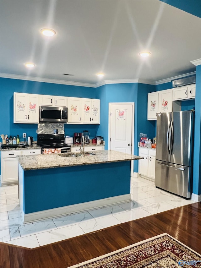 kitchen with a kitchen island with sink, white cabinets, light stone countertops, and appliances with stainless steel finishes