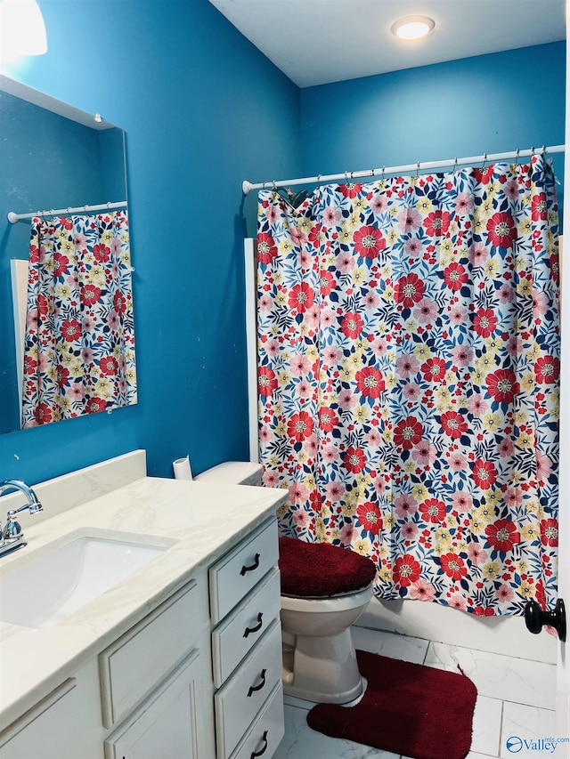 bathroom featuring vanity and toilet