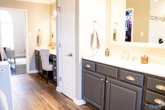 1508 Berrivine Dr, Hartselle, AL 35640 - full bath featuring wood finished floors, vanity, ornamental molding, and baseboards