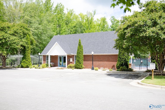 1508 Berrivine Dr, Hartselle, AL 35640 - view of front facade with brick siding, fence, and a shingled roof