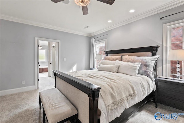 bedroom featuring crown molding, light carpet, ensuite bathroom, and ceiling fan