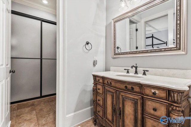 bathroom featuring vanity, ornamental molding, and tile patterned floors