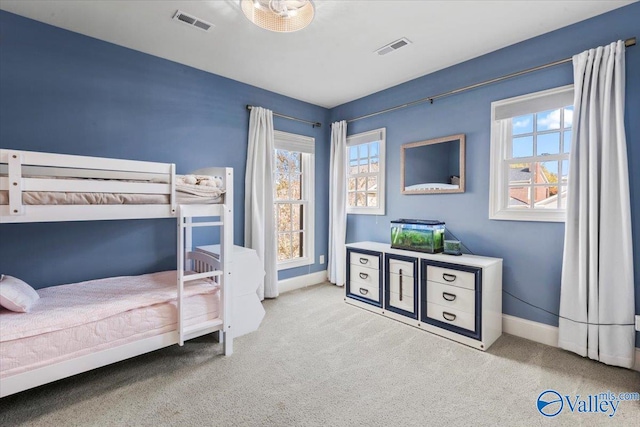 bedroom featuring light colored carpet