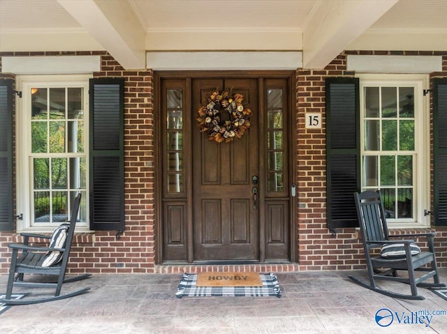 doorway to property with covered porch