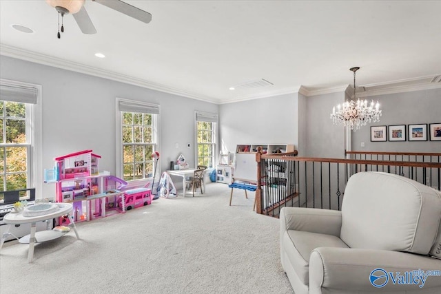 game room with ornamental molding, carpet, and ceiling fan with notable chandelier