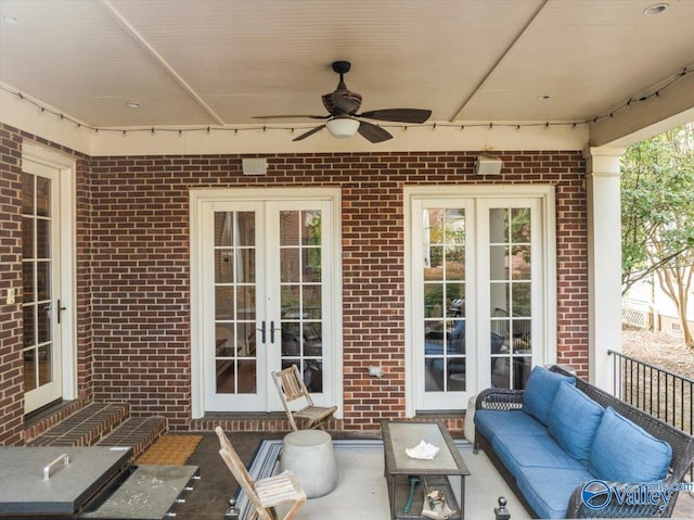 view of patio featuring french doors, an outdoor living space, and ceiling fan