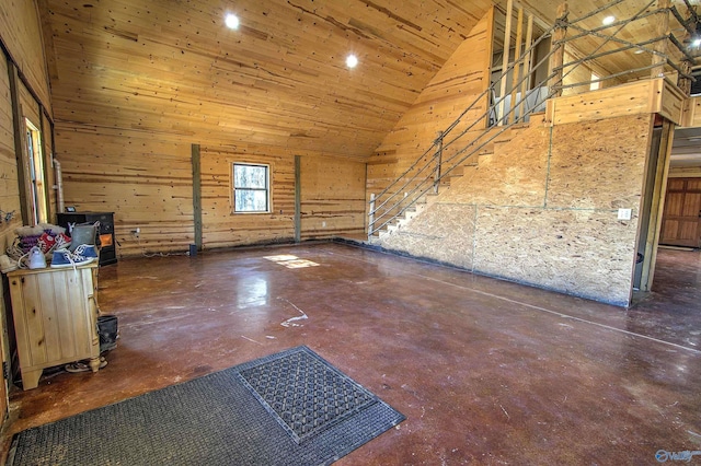 spare room featuring wood ceiling and high vaulted ceiling