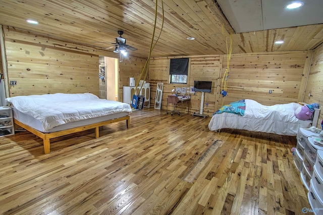 bedroom featuring hardwood / wood-style floors, wood ceiling, and wood walls