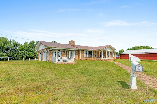 ranch-style house with a front lawn