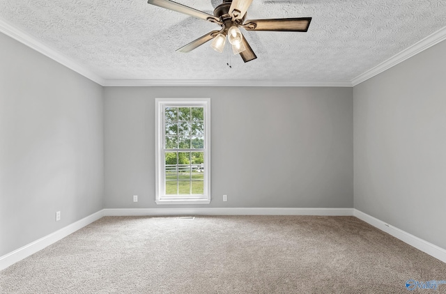 empty room with carpet flooring, a textured ceiling, ceiling fan, and crown molding