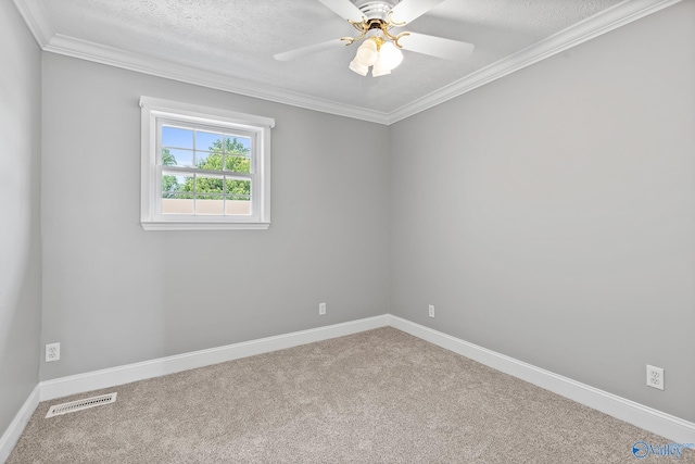 empty room with crown molding, carpet, ceiling fan, and a textured ceiling