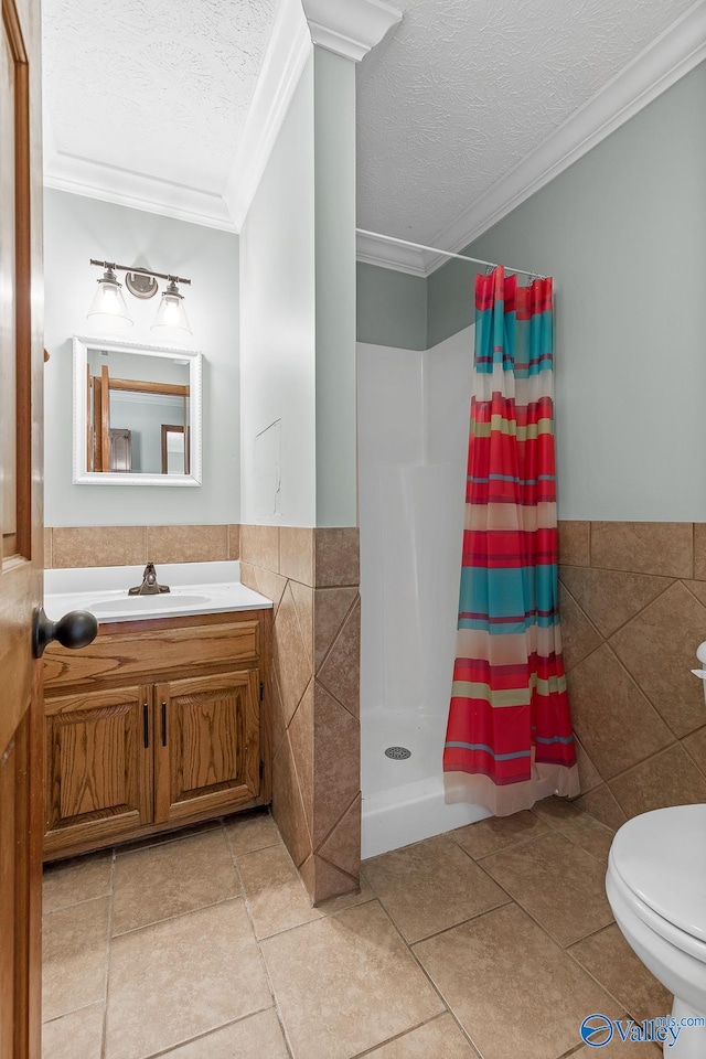 bathroom with tile walls, walk in shower, crown molding, a textured ceiling, and tile patterned floors